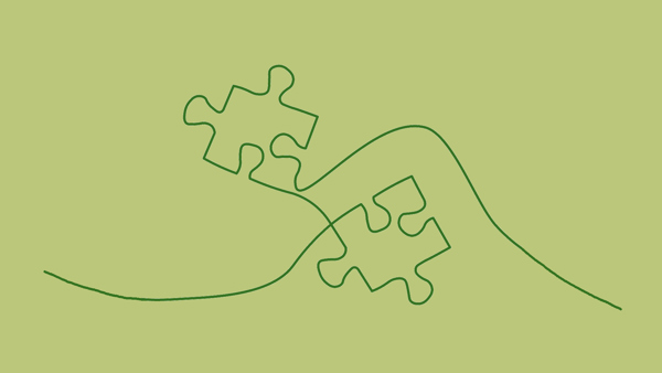 Illustration på två pusselbitar i grönt